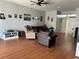 Spacious living room with hardwood floors and comfortable seating at 148 Joewood Trl, Davenport, FL 33837
