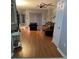 Spacious living room with hardwood floors, comfy seating, and sliding doors at 148 Joewood Trl, Davenport, FL 33837