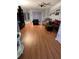 Spacious living room with hardwood floors, comfy seating, and sliding doors at 148 Joewood Trl, Davenport, FL 33837