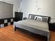 Main bedroom with king-size bed and hardwood floors at 148 Joewood Trl, Davenport, FL 33837