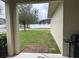 Brick patio, grassy yard, and white vinyl fence in the backyard at 15043 Pigeon Plum Ln, Winter Garden, FL 34787