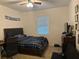 Bedroom with a double bed, desk, and TV at 15043 Pigeon Plum Ln, Winter Garden, FL 34787