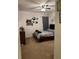 Bright bedroom with a double bed and wall decor at 15043 Pigeon Plum Ln, Winter Garden, FL 34787