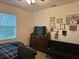 Bedroom with double bed, dresser, and couch at 15043 Pigeon Plum Ln, Winter Garden, FL 34787