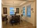 Dining room features a chandelier and large windows at 15043 Pigeon Plum Ln, Winter Garden, FL 34787