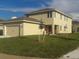Two-story house with attached garage and landscaping at 15043 Pigeon Plum Ln, Winter Garden, FL 34787