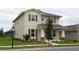 Two-story house with neutral siding, shutters, and landscaping at 15043 Pigeon Plum Ln, Winter Garden, FL 34787