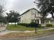 Two-story house with neutral siding, shutters, and landscaping at 15043 Pigeon Plum Ln, Winter Garden, FL 34787