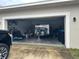 Garage with bicycles, tools, and a trailer at 15043 Pigeon Plum Ln, Winter Garden, FL 34787