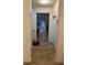 Long hallway with tile floors and access to rooms at 15043 Pigeon Plum Ln, Winter Garden, FL 34787