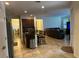 Open kitchen with island and views into the Gathering room at 15043 Pigeon Plum Ln, Winter Garden, FL 34787