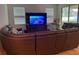 Spacious living room with sectional sofa and large TV at 15043 Pigeon Plum Ln, Winter Garden, FL 34787