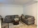 Living room with gray sofas and a coffee table at 15043 Pigeon Plum Ln, Winter Garden, FL 34787