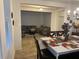 Open concept living and dining area with neutral decor at 15043 Pigeon Plum Ln, Winter Garden, FL 34787