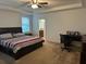 Spacious main bedroom with a large bed and ensuite bathroom at 15043 Pigeon Plum Ln, Winter Garden, FL 34787