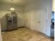 Well-organized pantry with double doors at 15043 Pigeon Plum Ln, Winter Garden, FL 34787