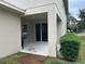 Covered patio with access door and view of backyard at 15043 Pigeon Plum Ln, Winter Garden, FL 34787