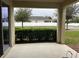 Covered patio with view of street and lawn at 15043 Pigeon Plum Ln, Winter Garden, FL 34787