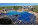Community pool with a large deck and plenty of lounge chairs at 15043 Pigeon Plum Ln, Winter Garden, FL 34787