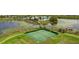 Well-maintained tennis courts with surrounding green space at 15043 Pigeon Plum Ln, Winter Garden, FL 34787