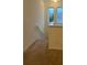 Upstairs hall with carpet and a railing at 15043 Pigeon Plum Ln, Winter Garden, FL 34787