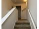 Upstairs hallway with carpet and three doors at 15043 Pigeon Plum Ln, Winter Garden, FL 34787