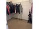 Large walk-in closet with hanging rods and shelving at 15043 Pigeon Plum Ln, Winter Garden, FL 34787