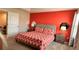 Bright bedroom with a comfortable bed and an accent wall at 1515 Carey Palm Cir, Kissimmee, FL 34747