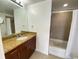 Bathroom with granite vanity and a tub shower combo at 155 S Court Ave # 1603, Orlando, FL 32801