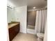 Bathroom with granite vanity and a tub shower combo at 155 S Court Ave # 1603, Orlando, FL 32801