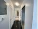 Hallway with tile floors and doors to bedrooms and bathroom at 155 S Court Ave # 1603, Orlando, FL 32801