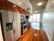 Modern kitchen with stainless steel appliances and dark wood cabinets at 155 S Court Ave # 1603, Orlando, FL 32801