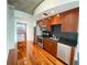 Modern kitchen with stainless steel appliances and dark wood cabinets at 155 S Court Ave # 1603, Orlando, FL 32801