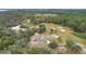 Aerial view showing home's location on a spacious lot with surrounding trees at 1960 Murray Rd, Fort Meade, FL 33841