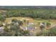 Aerial view of home on large lot with mature trees and open space at 1960 Murray Rd, Fort Meade, FL 33841