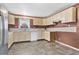 Kitchen with light cabinets, stainless steel appliances, and tile floors at 1960 Murray Rd, Fort Meade, FL 33841