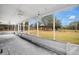 Spacious screened porch overlooking backyard and open space at 1960 Murray Rd, Fort Meade, FL 33841