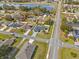 Aerial view of the house and neighborhood, near a lake at 202 Cobalt Dr, Kissimmee, FL 34758