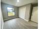 Spacious bedroom with window, closet, and light gray flooring at 202 Cobalt Dr, Kissimmee, FL 34758
