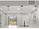 Modern kitchen with white cabinets, quartz countertops and island at 202 Cobalt Dr, Kissimmee, FL 34758