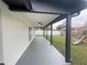 Covered patio with ceiling fans overlooks the spacious backyard at 202 Cobalt Dr, Kissimmee, FL 34758