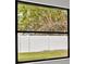 Window view of backyard and trees at 202 Cobalt Dr, Kissimmee, FL 34758