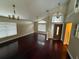 Bright living room with hardwood floors and high ceilings at 224 Greenwich St, Davenport, FL 33896