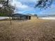 Large backyard with pool and home view at 228 Whispering Pines Way, Davenport, FL 33837