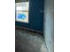 Empty bedroom with window and blue walls at 228 Whispering Pines Way, Davenport, FL 33837