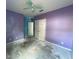 Large bedroom with purple walls and ample closet space at 228 Whispering Pines Way, Davenport, FL 33837