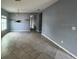 Bright dining area with tile flooring and access to other rooms at 228 Whispering Pines Way, Davenport, FL 33837