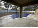 Screened-in pool area with covered patio at 228 Whispering Pines Way, Davenport, FL 33837