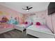 Princess themed bedroom with two twin-size beds at 2461 Reading Trl, Kissimmee, FL 34746