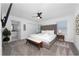 Spacious primary bedroom with king-size bed and ensuite bathroom at 2461 Reading Trl, Kissimmee, FL 34746